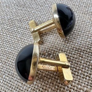 swank vintage men’s cuff links. Gold tone with Dark ruby red stone .